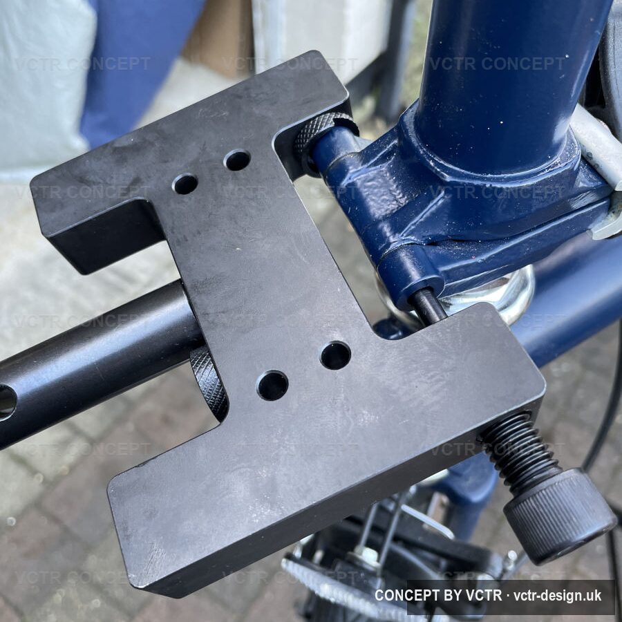 A Brompton stem hinge pin being replaced with a workshop jig