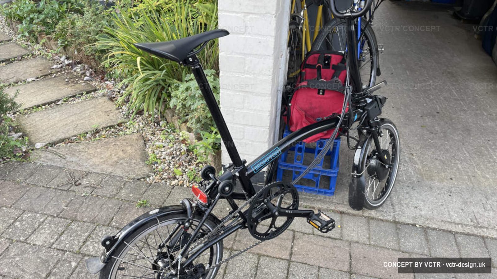 A Brompton folding bicycle outside the workshop