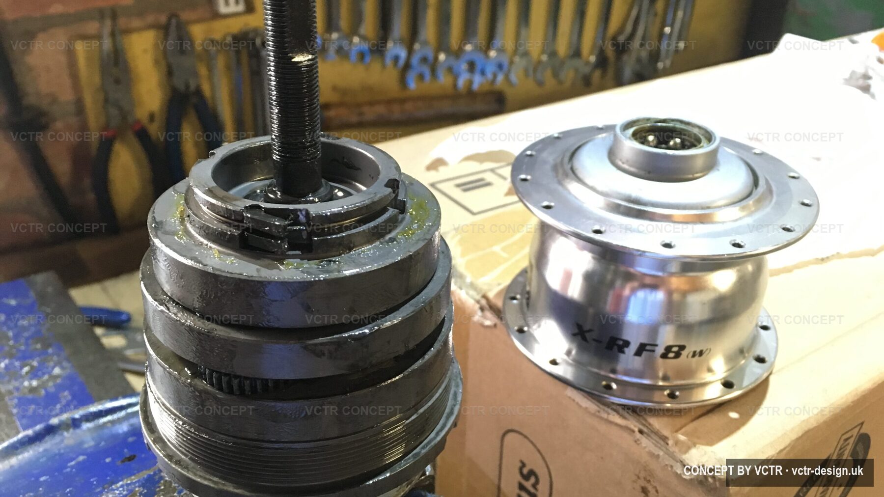 Hub internals stacked on the bench during a strip-down