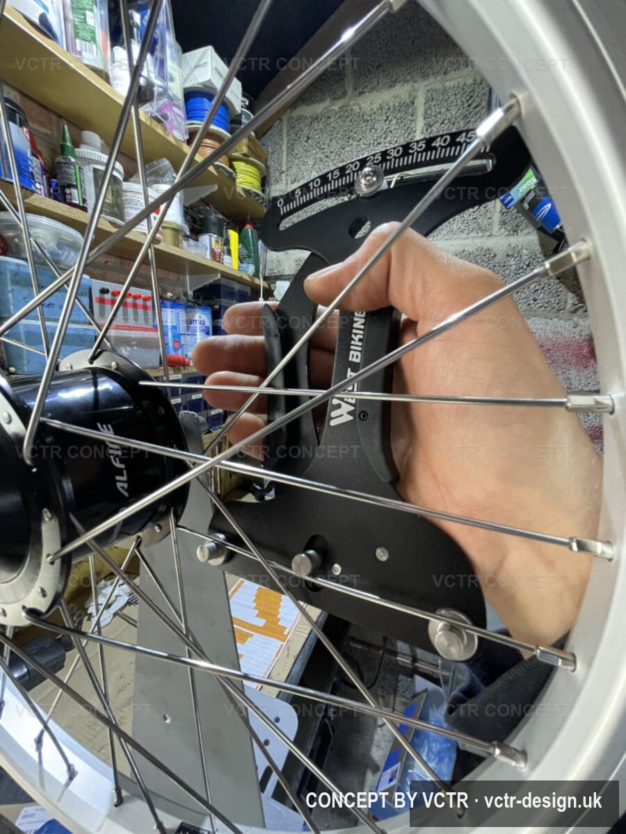 A wheel being laced and trued by hand